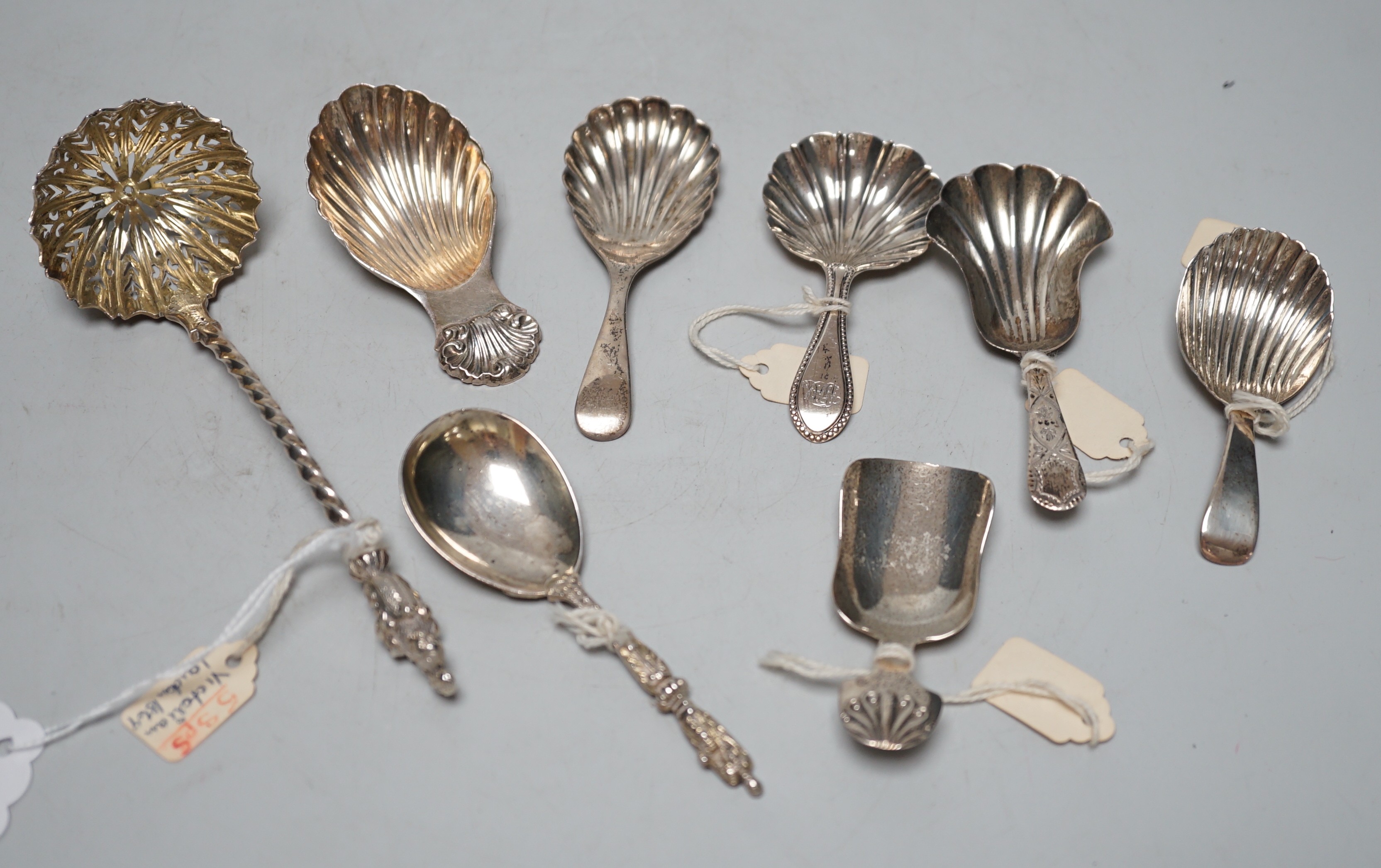 Three assorted 19th century silver caddy spoons, including London, 1829, three 20th century silver caddy spoons and two other silver spoons including Victorian sifter spoon, 14.7cm.